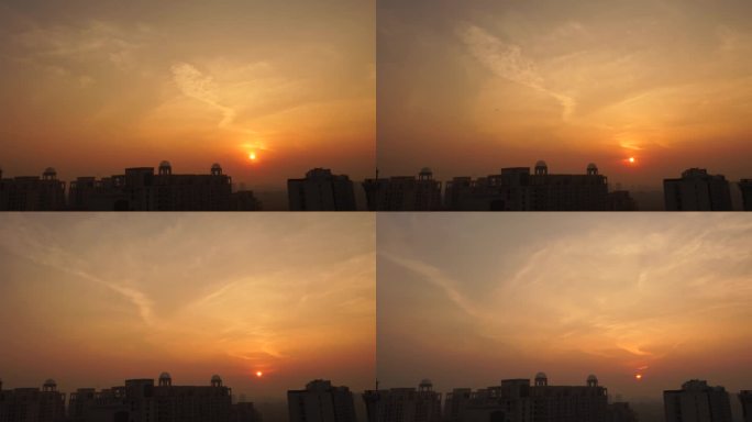 夕阳西下夜幕降临城市剪影夕阳黄昏天空云彩