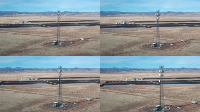 无人机拍摄的犹他州沙漠5G手机塔在一个阳光明媚的冬日，天空充满了云