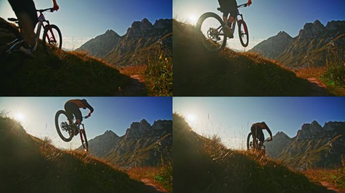 慢动作男子骑自行车越过草山对落基山脉和蓝天在阳光明媚的一天