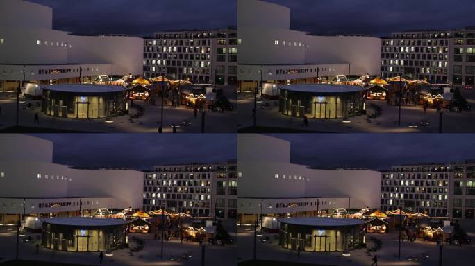德国杜塞尔多夫——2022年12月13日:傍晚时分，市中心熙攘攘攘，公共交通、人们步行、灯光和圣诞市
