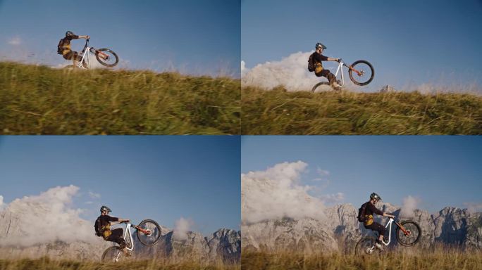 男子山地自行车手在草地上用自行车表演轮滑的镜头