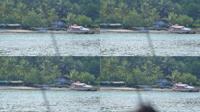 海滩上有失事和废弃的摩托艇，热带岛屿上有森林和山丘之间的住宅，岛上有椰子树