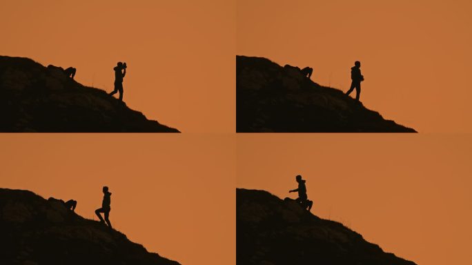 SLO - MO锁定镜头，男性攀岩者通过相机拍摄，而女性躺在山上，对着清澈的橙色天空