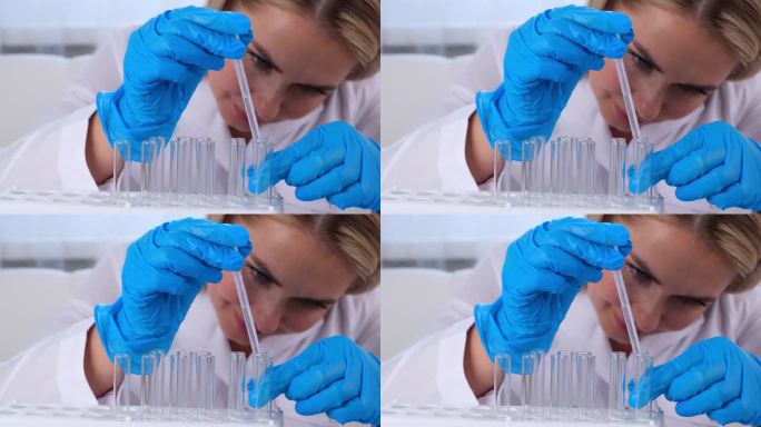 近距离研究化学家为研究采集样本，在实验室里用微移液管和显微镜工作。