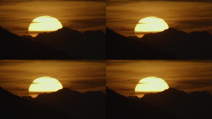 SLO - MO风景如画的日落时分，田园诗般的太阳在剪影山