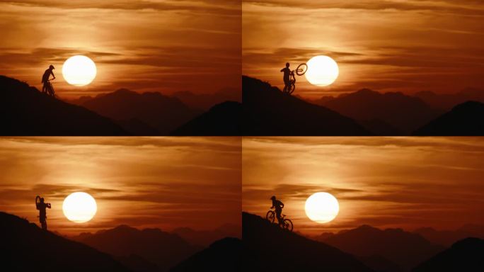 SLO MO锁定的剪影山地自行车手携带和推动自行车，而移动上山对戏剧性的日落天空