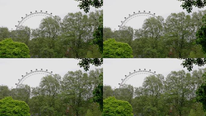 2023年5月22日，英国伦敦:伦敦威斯敏斯特圣詹姆斯公园，长镜头拍摄的伦敦眼缓缓移动
