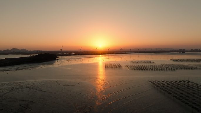 日落夕阳海边风车风力发电