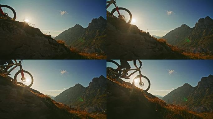 慢动作男子骑自行车在草山对落基山脉和蓝天在阳光明媚的一天
