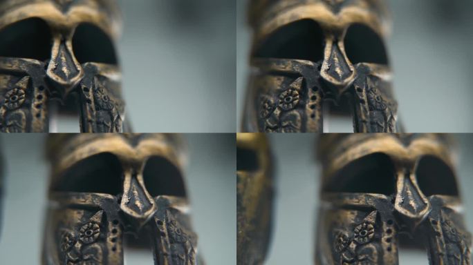 一个斯巴达设计的特写微距镜头，两个不同的古代战士金属青铜头盔，纹理形状，工作室照明，全高清电影视频，