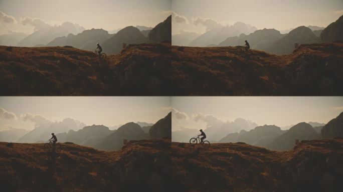 SLO MO锁定拍摄的男子骑自行车在落基山对天空在阳光明媚的一天