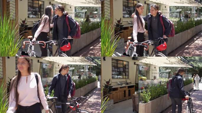 同事们扛着自行车在城市里道别