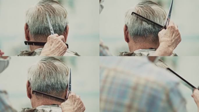 一位老人正在理发店理发