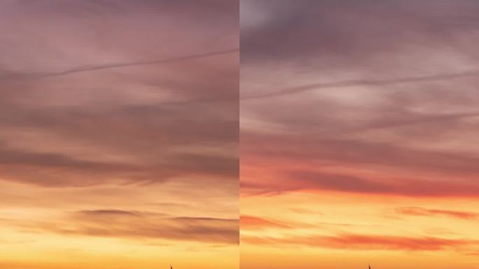 垂直视频。海边码头的日出，帆船沿着海岸停泊。太阳从山后升起，把天空描绘成火红的阴影。