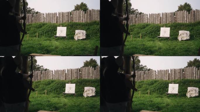 一名女子在射击场向靶标射箭。箭的飞行是用慢镜头拍摄的