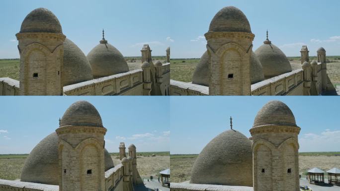 哈萨克斯坦阿利斯坦巴布陵墓的塔楼和圆顶，由烧砖和雪花石膏灰浆制成。无人机的轨道