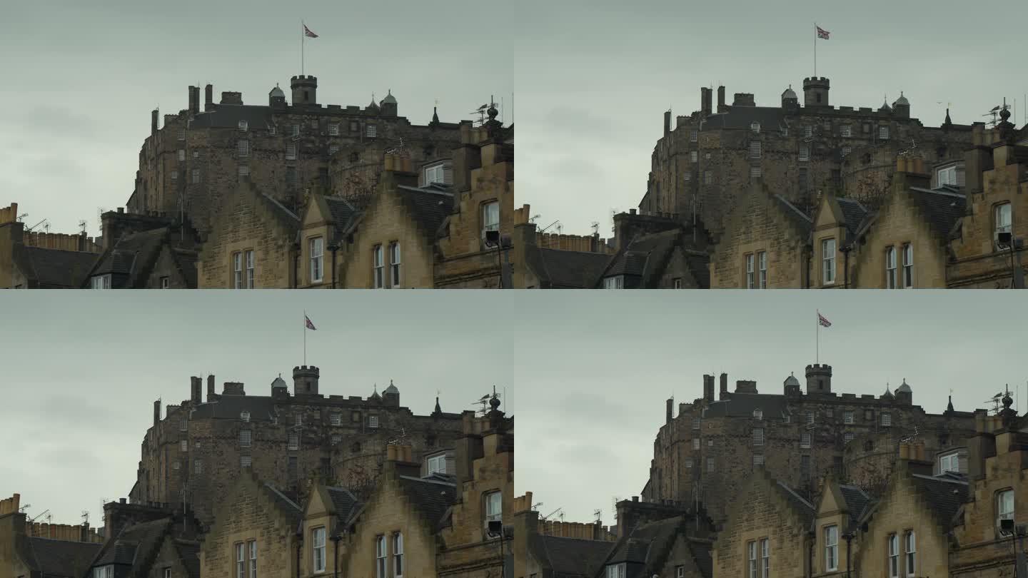阴天，著名的爱丁堡城堡矗立在古老的石头联排别墅的屋顶上