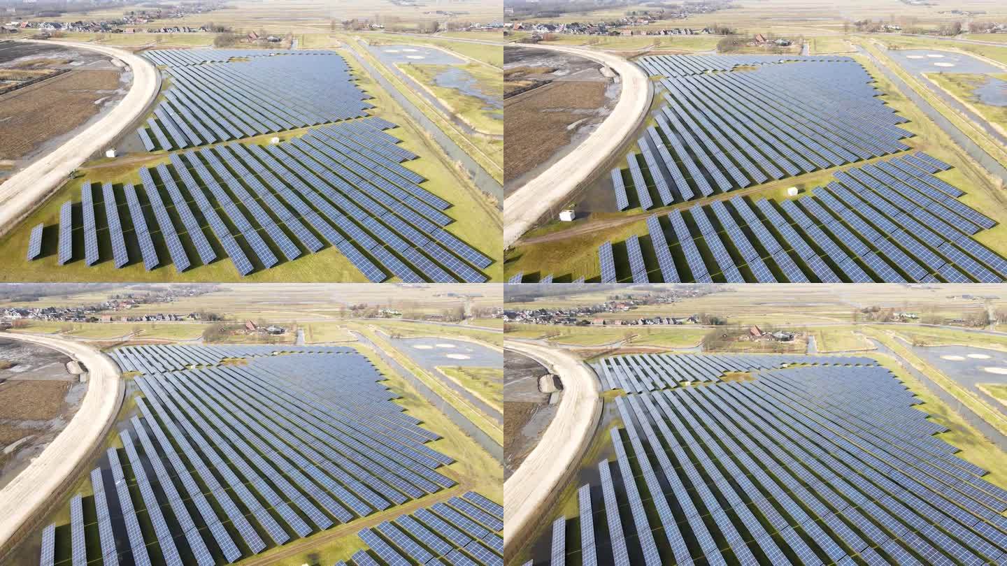 太阳能电池板公园，无人机拍摄的多个太阳能电池板排列在农村地区。