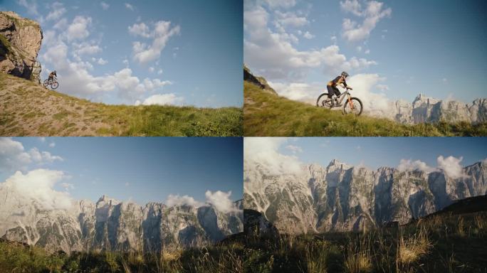 SLO MO手持拍摄的男子骑自行车表演特技，而骑在草地上对落基山脉和蓝天
