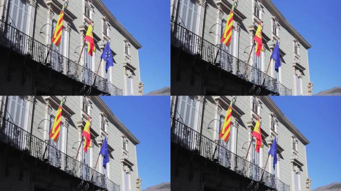 瓦伦西亚社区、西班牙和欧盟的旗帜飘扬在瓦伦西亚美丽建筑的阳台上。高品质4k画面