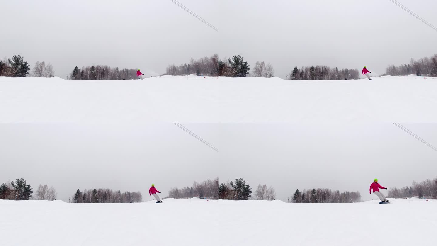 慢动作镜头，一个女滑雪板运动员走近相机，刹车，在镜头前撒雪