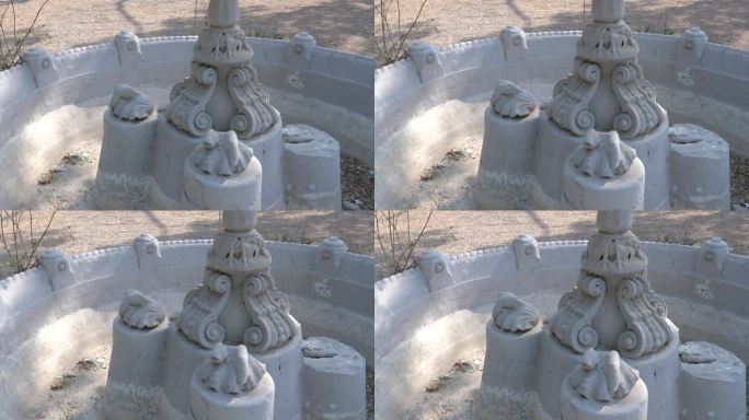 巴基斯坦卡拉奇古尔拜妇产之家白天白色大理石喷泉底座的特写镜头。