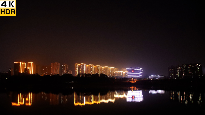 城市夜景延时变化沩水河日落高楼霓虹光4K