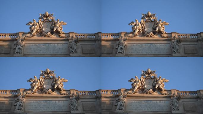 在阳光明媚的早晨，在特莱维喷泉顶部的特写雕塑，古老的巴洛克式建筑的Palazzo palace小儿麻