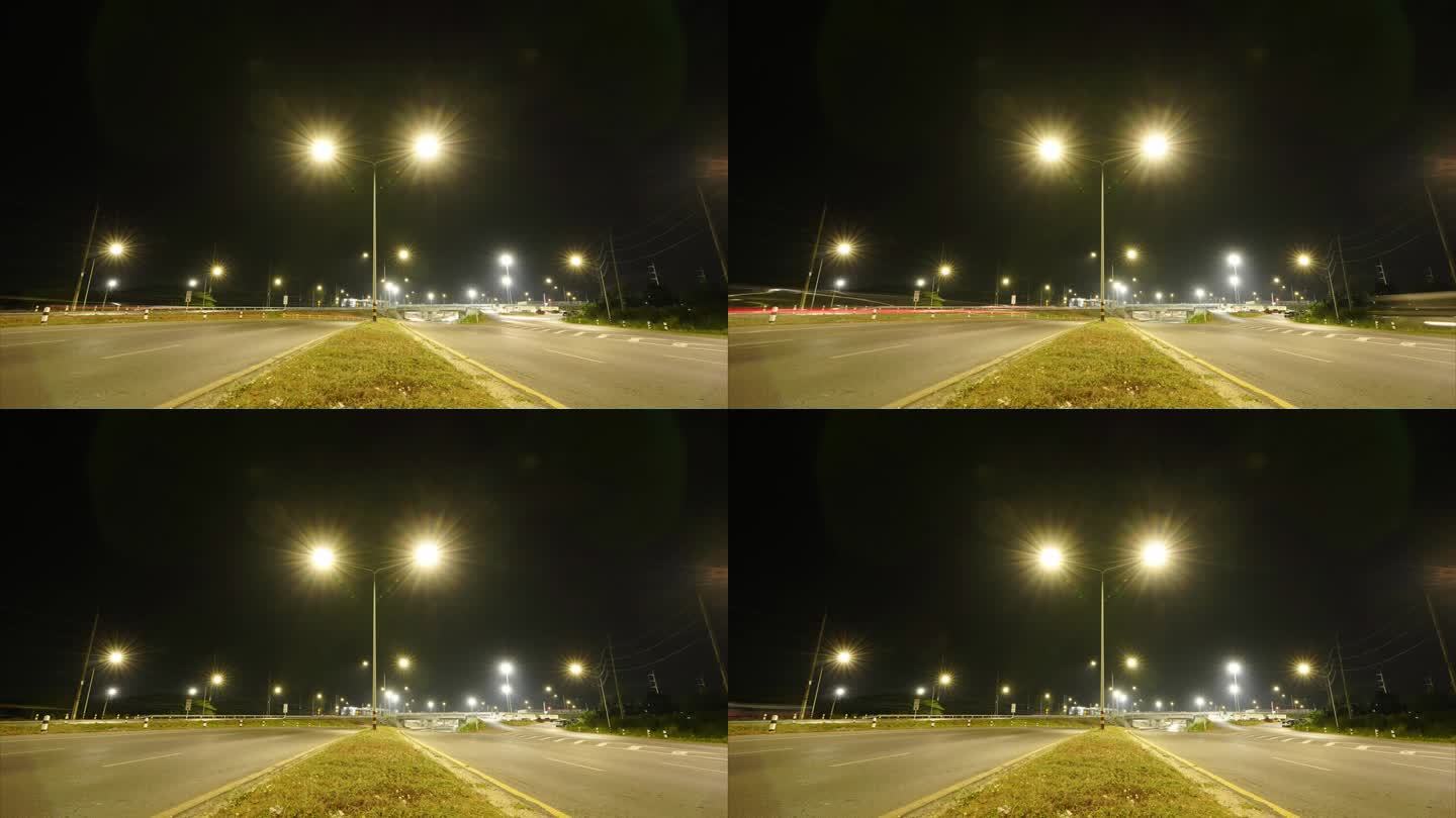 航拍延时，多个路口，长曝光辉光线，城市高速公路夜间车辆行驶在路口的4k视频