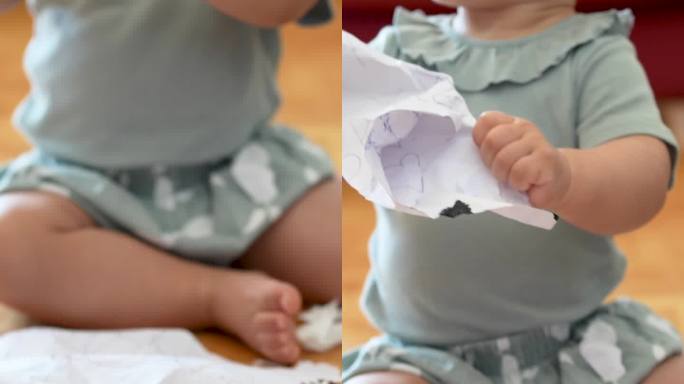 宝宝忙着撕纸