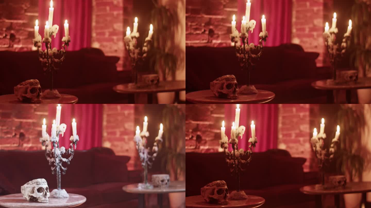墨西哥骷髅头和圆桌上燃烧的蜡烛