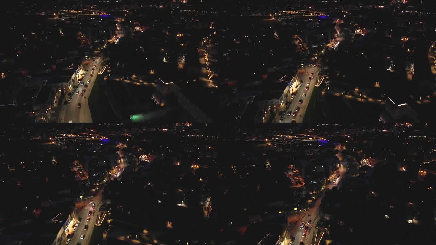 无人机拍摄的意大利艾米利亚-罗马涅地区里米尼市街道和建筑物的夜间画面