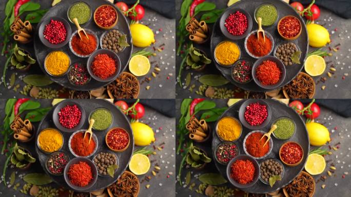 烹饪用的五颜六色的香草和香料。印度的香料。黑色背景。俯视图