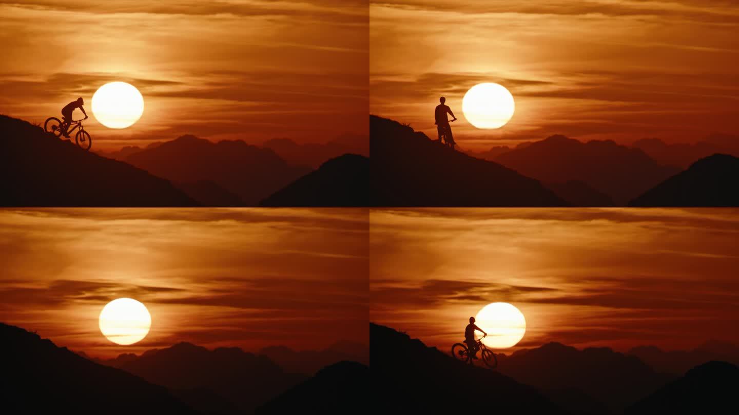 SLO MO -时间扭曲效果/速度坡道锁定的剪影山地自行车手移动下山对田园诗般的夕阳在戏剧性的天空