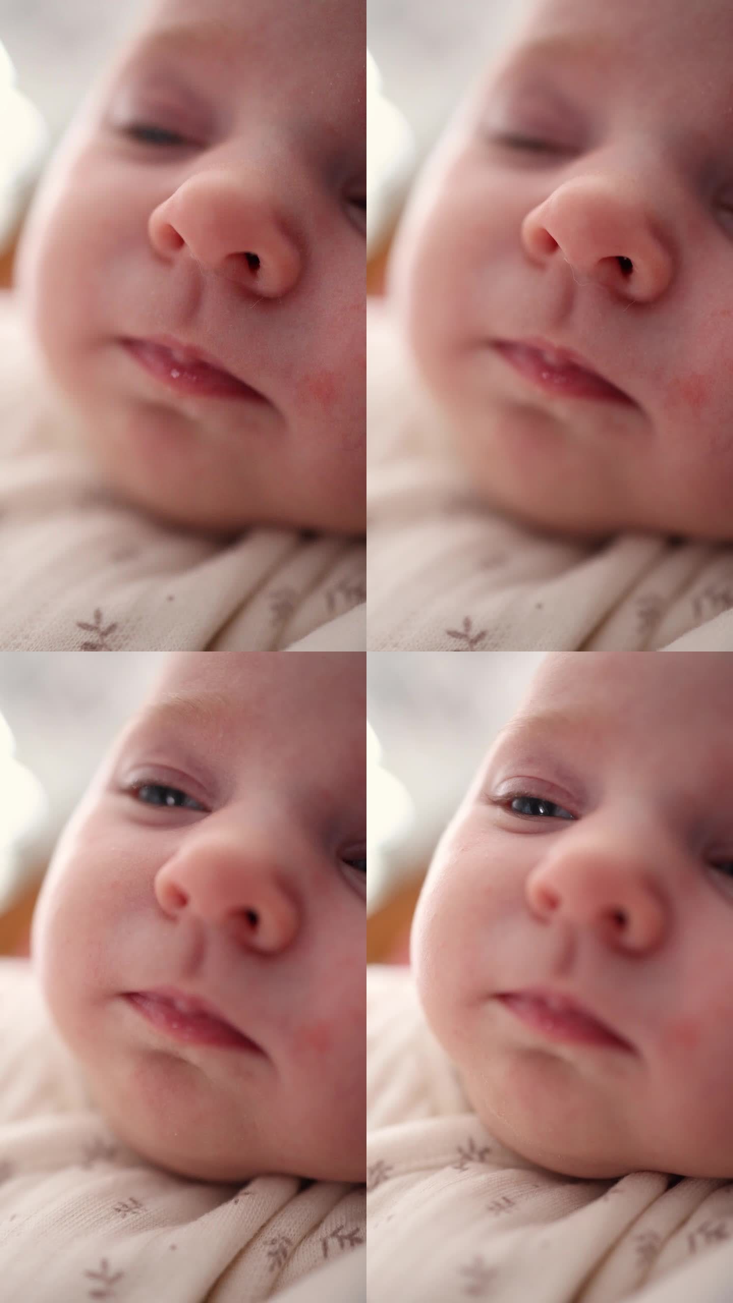 一个小孩睡着的脸部特写。嘴唇，鼻子，眼睛。宏。垂直视频。宝宝头半脸