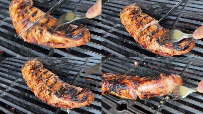 煮熟多汁的牛排，牛肉刷上迷迭香，在燃烧的烤架上，周围是其他肉类和香肠。慢动作
