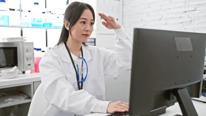 Young chinese scientist woman's happy gaze far awa