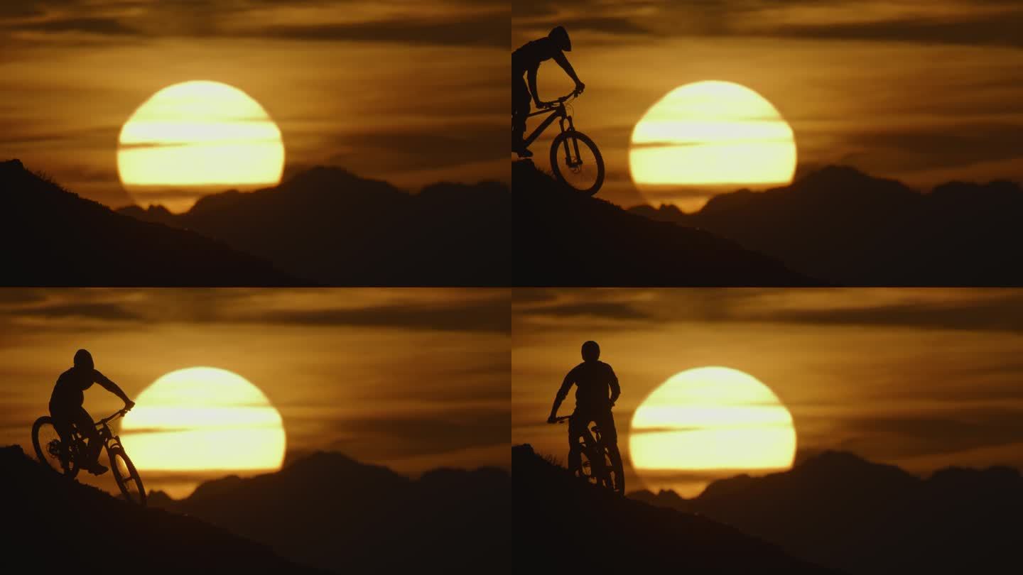 SLO MO锁定镜头的剪影山地自行车下降和站在山上对田园诗般的太阳日落