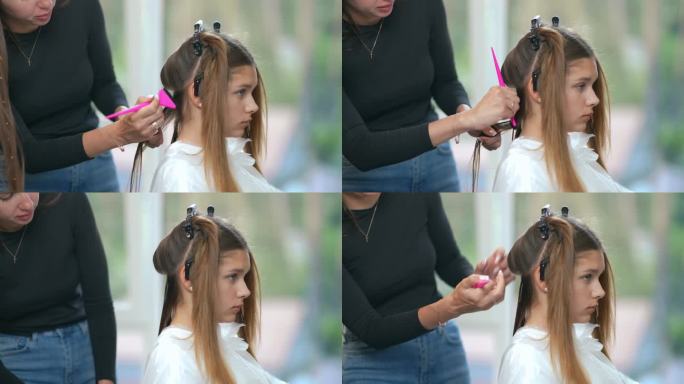 一位美发老师展示了如何用梳子给客户头上的一缕头发正确上色。