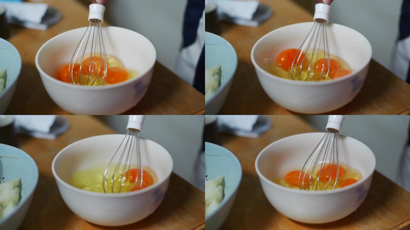 蛋黄与蛋白在白碗中轻轻搅打，拍摄如手持特写镜头