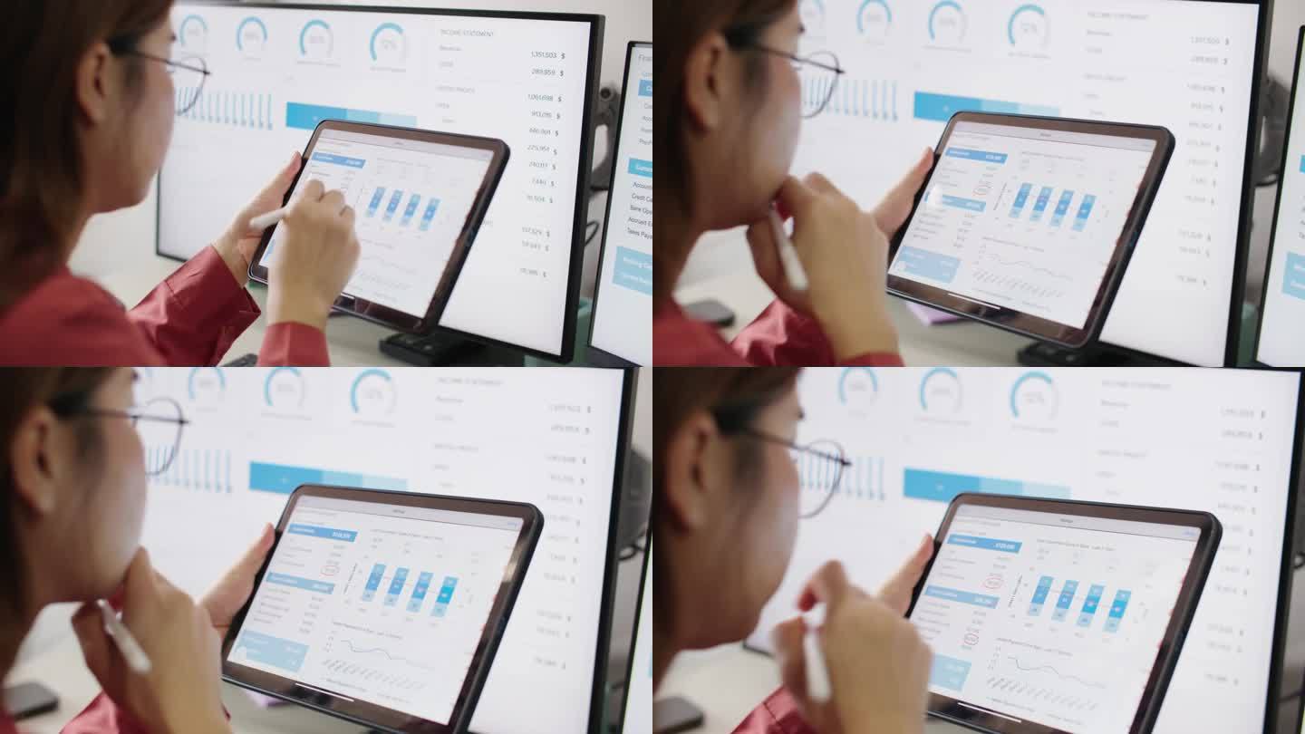 年轻女子的手正在使用平板电脑和触控笔检查财务预算的细节