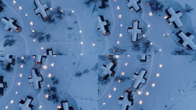 挪威冬日夜晚的雪旅馆顶视图。空中俯视图