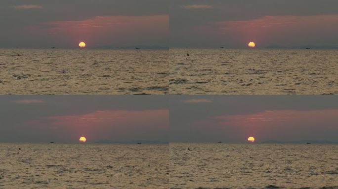 橘黄色的太阳落在地平线下，给大海画上了涟漪。渔船在远处平静地颠簸着