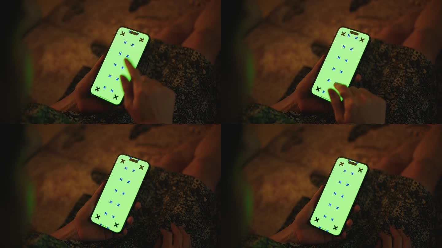 晚上，客厅的沙发上躺着一个拿着绿屏智能手机的女人
