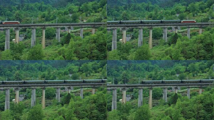绿皮火车 行驶在大山高架桥中