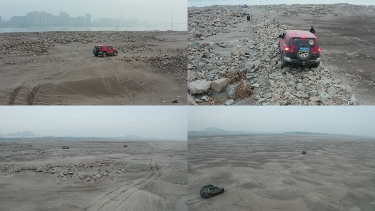 越野车行驶奔驰在武汉天兴洲礁石沙滩上航拍