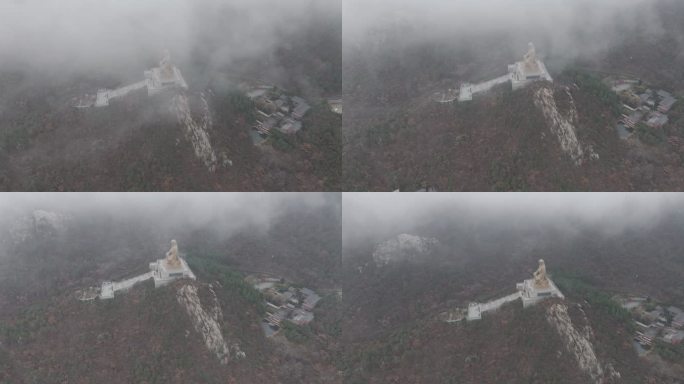 航拍冬季雨天云雾山东荣成石岛赤山明神座像