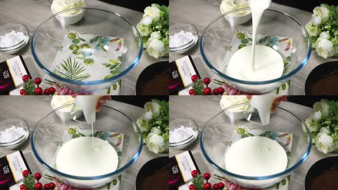 向碗中加入牛奶奶油。牛奶倒进碗里，特写。烘焙原料。