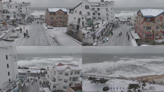 航拍威海国际海水浴场火炬八街冬季游客雪景