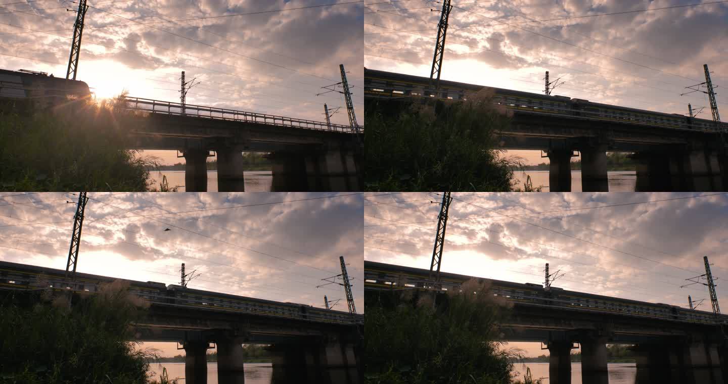 夕阳铁路桥梁绿皮火车过江